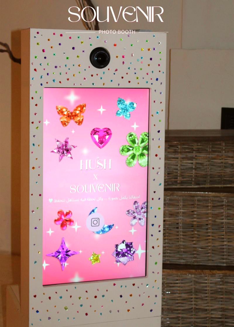Booth screen decorated with colourful butterflies for Hush Spa