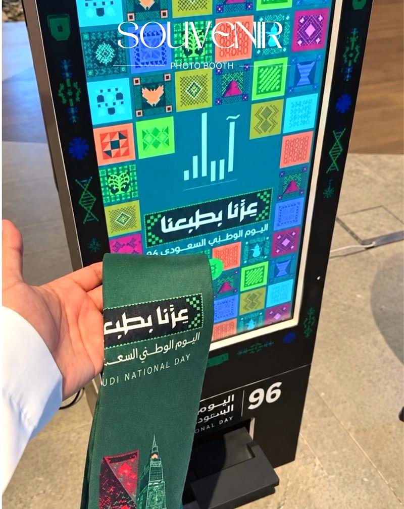 National Day themed booth screen with a printed photo